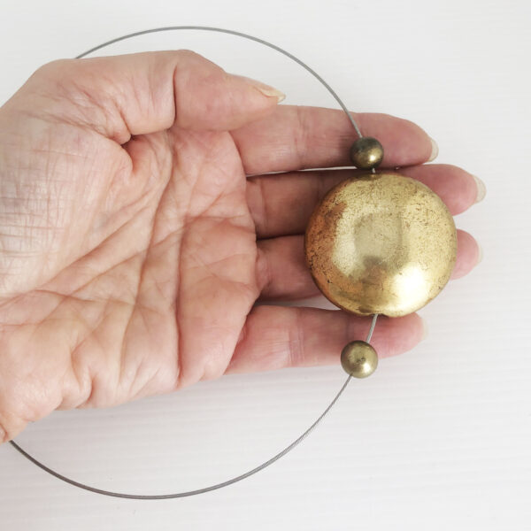 Collier in acciaio con centrale dorato